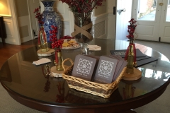 A table decorated with cookies, plants, and pamphlets with the Buena vista Logo.
